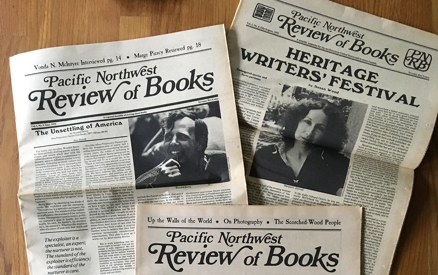 Three issues of the Pacific Northwest Review of Books, with headlines