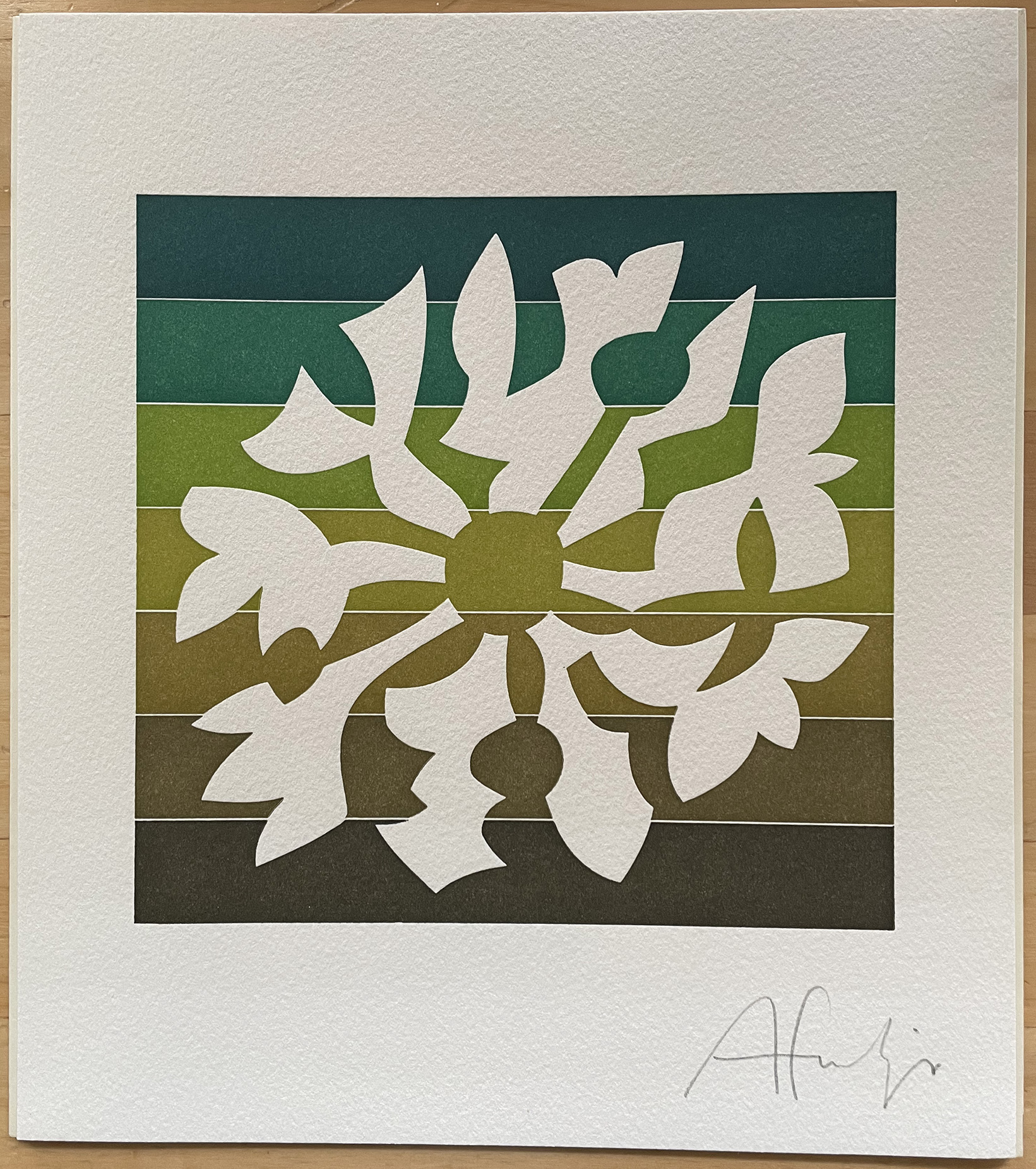 Print of angular floral shapes around an empty center; the shapes are paper-colored while behind them is a square of seven horizontal bands of color, all greenish or brownish.  Signature at bottom right: ‘Afrutiger’