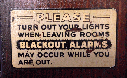 Blackout-alarm sign on the door in an old DC apartment